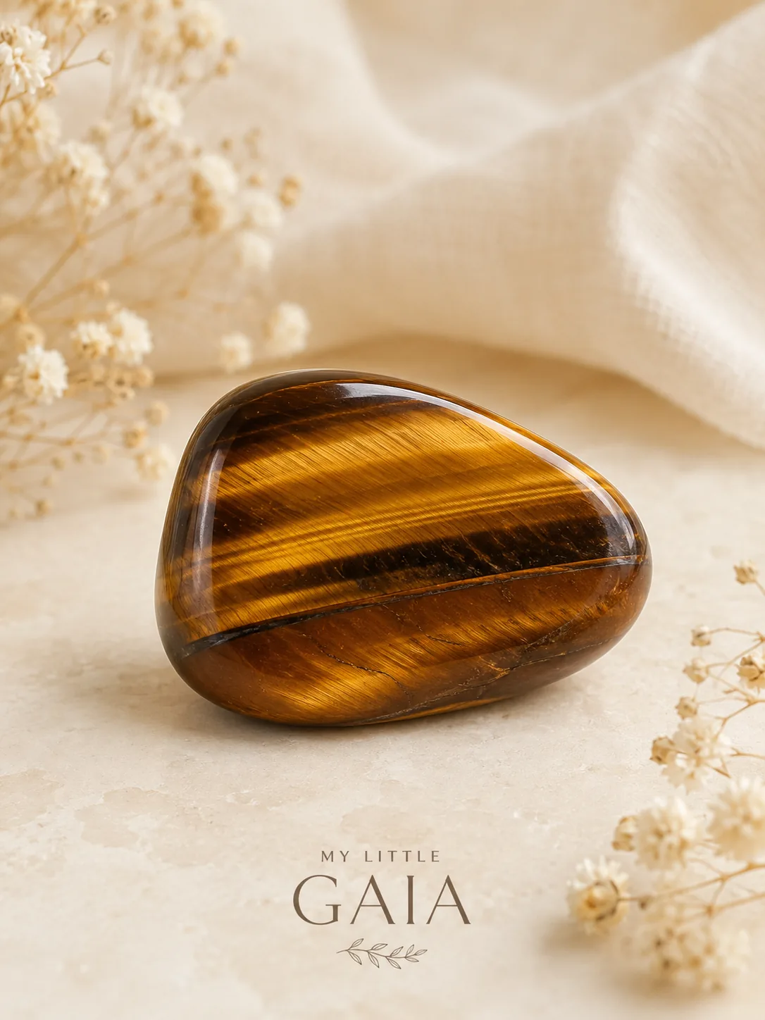 Close-up of polished tiger’s eye tumble stone with natural crystal texture
